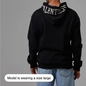 TALENTLESS Black Hoodie with White Logo Tag